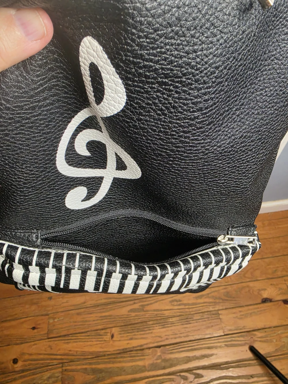 Black Musical Note Backpack with White Piano Detail